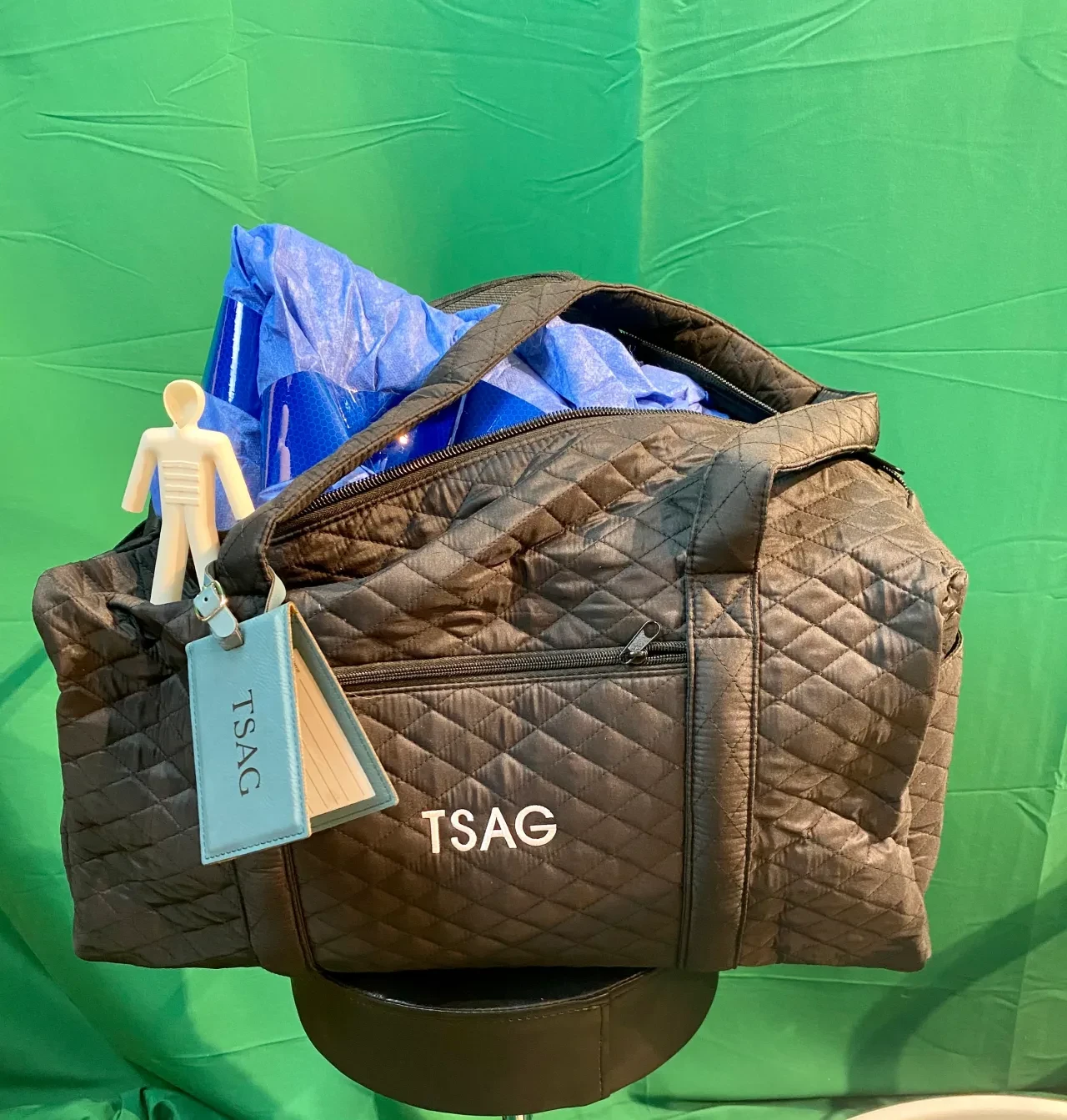 TSAG protective bag open showing the protective suit inside